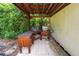 Outdoor kitchen features a grill and wooden countertops, nestled within lush greenery at 5120 Lunn Rd, Lakeland, FL 33811