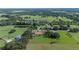 An aerial view of the property with its boundary outlined and beautiful surroundings of ponds and mature trees at 5140 Alderman Rd, Lakeland, FL 33810