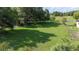 A lush, expansive backyard with mature trees and greenery, creating a serene outdoor space at 5140 Alderman Rd, Lakeland, FL 33810