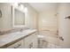 Well-lit bathroom featuring a vanity and shower/tub combo at 5140 Alderman Rd, Lakeland, FL 33810