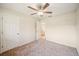 Cozy bedroom with a ceiling fan and plush carpet at 5140 Alderman Rd, Lakeland, FL 33810
