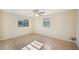A bedroom with neutral paint, tile flooring, a ceiling fan, and windows at 5140 Alderman Rd, Lakeland, FL 33810