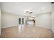 Spacious living room featuring tile flooring, neutral paint, and open design to kitchen at 5140 Alderman Rd, Lakeland, FL 33810