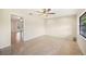 Bright living room with neutral paint, tile flooring, and a ceiling fan at 5140 Alderman Rd, Lakeland, FL 33810