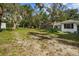 Spacious backyard with trailer and large trees at 545 Prado Pl, Lakeland, FL 33803