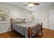 Bedroom featuring wood floors, ceiling fan and windows for natural light at 545 Prado Pl, Lakeland, FL 33803