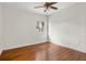 Bedroom featuring hardwood floors and natural light from the window at 545 Prado Pl, Lakeland, FL 33803