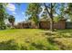 Brick home exterior featuring a lawn and mature trees at 545 Prado Pl, Lakeland, FL 33803