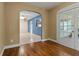 Bright hallway featuring hardwood floors, archways, and french doors at 545 Prado Pl, Lakeland, FL 33803