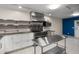 Bright kitchen features stainless steel appliances, custom cabinets, and ample workspace at 545 Prado Pl, Lakeland, FL 33803