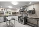 Spacious kitchen featuring stainless steel appliances, work tables and patterned flooring at 545 Prado Pl, Lakeland, FL 33803