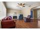 Cozy living room featuring hardwood floors, fireplace, and comfortable seating at 545 Prado Pl, Lakeland, FL 33803