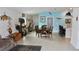 Bright open floor plan with dining area, breakfast bar, and unique nautical decor creates a warm, inviting space at 550 Patton Loop, Bartow, FL 33830
