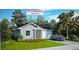 Charming one-story home featuring a neutral color scheme, well-manicured lawn, and lovely curb appeal at 5927 Cormorant Ct, Lakeland, FL 33809