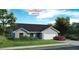 Charming single-story home featuring a well-manicured lawn, two-car garage, and neutral color palette at 5976 Cormorant Ct, Lakeland, FL 33809