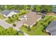 Stunning aerial view of the estate home highlighting its expansive grounds, circular driveway, and screened in pool area at 6475 Avalon Woods Dr, Lakeland, FL 33813