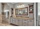 Well-lit bathroom vanity with granite counters and custom storage at 6475 Avalon Woods Dr, Lakeland, FL 33813