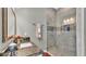 Elegant bathroom featuring granite counters, and walk-in shower at 6475 Avalon Woods Dr, Lakeland, FL 33813