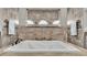 A large, bright bathtub is surrounded by tiled walls and decorative tiling accents at 6475 Avalon Woods Dr, Lakeland, FL 33813