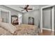 Bright bedroom with neutral walls, wood floors, and walk-in closets at 6475 Avalon Woods Dr, Lakeland, FL 33813
