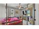 Cozy bedroom with ceiling fan and natural light at 6475 Avalon Woods Dr, Lakeland, FL 33813