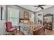 Well-lit bedroom with a view of the pool and a luxurious queen-size bed at 6475 Avalon Woods Dr, Lakeland, FL 33813