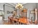The dining room features a large chandelier and plenty of room to entertain guests at 6475 Avalon Woods Dr, Lakeland, FL 33813