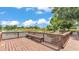 Lake view featuring a wooden dock with built-in benches, perfect for relaxing and enjoying the natural surroundings at 6475 Avalon Woods Dr, Lakeland, FL 33813