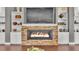 Close up of a modern stone fireplace with built-in shelving at 6475 Avalon Woods Dr, Lakeland, FL 33813