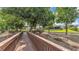Beautiful view of the walkway leading to the dock, with the house and screened lanai visible in the background at 6475 Avalon Woods Dr, Lakeland, FL 33813