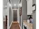 Hallway featuring hardwood floors and security keypad at 6475 Avalon Woods Dr, Lakeland, FL 33813