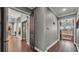 Hallway with hardwood floors provides access to multiple rooms within the home at 6475 Avalon Woods Dr, Lakeland, FL 33813