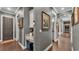 Hallway featuring hardwood floors and security keypad at 6475 Avalon Woods Dr, Lakeland, FL 33813