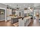 Gourmet kitchen with granite countertops, custom cabinets, stainless steel appliances, and double islands at 6475 Avalon Woods Dr, Lakeland, FL 33813