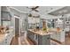 Kitchen with stainless steel appliances, granite countertops, a breakfast bar, and custom cabinetry at 6475 Avalon Woods Dr, Lakeland, FL 33813