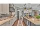Modern kitchen with stainless steel appliances, granite countertops, a double sink, and custom cabinetry at 6475 Avalon Woods Dr, Lakeland, FL 33813