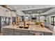 Open concept kitchen with granite countertops, double sinks, stainless steel appliances, and custom cabinetry at 6475 Avalon Woods Dr, Lakeland, FL 33813