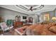 The main bedroom offers a sitting area, ceiling fan, and hardwood floors at 6475 Avalon Woods Dr, Lakeland, FL 33813
