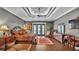 The main bedroom features hardwood floors, ceiling fan, and access to the back patio at 6475 Avalon Woods Dr, Lakeland, FL 33813