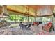 Enjoy this screened-in patio, outdoor kitchen, and seating areas with a view at 6475 Avalon Woods Dr, Lakeland, FL 33813
