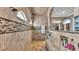 Large tiled shower with bench seating and overhead shower heads at 6475 Avalon Woods Dr, Lakeland, FL 33813