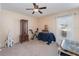 Bedroom featuring neutral colors, a ceiling fan, and a cozy atmosphere at 6789 Ashbury Dr, Lakeland, FL 33809