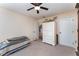 Bedroom with a ceiling fan, white trim, and neutral walls at 6789 Ashbury Dr, Lakeland, FL 33809