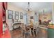 Inviting dining room with hardwood floors and stylish chandelier lighting at 6789 Ashbury Dr, Lakeland, FL 33809