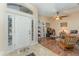 Spacious foyer with tile transitioning to wood floors and clear view into the living room at 6789 Ashbury Dr, Lakeland, FL 33809