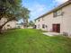 Lawn with a patio area perfect for outdoor seating at 803 Orchid Springs Dr, Winter Haven, FL 33884