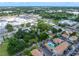 Aerial view of property surrounded by lush trees in a suburban neighborhood at 829 N Lake Ave, Lakeland, FL 33801