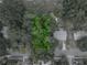 A verdant lot surrounded by quiet streets and a community pool awaits your vision at 829 N Lake Ave, Lakeland, FL 33801