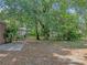 The backyard offers lots of shade, privacy and a patio at 829 N Lake Ave, Lakeland, FL 33801