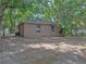 This backyard features a concrete patio and chain link fencing at 829 N Lake Ave, Lakeland, FL 33801